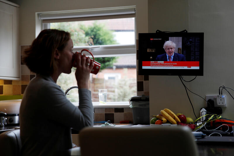 Woman watching BBC news