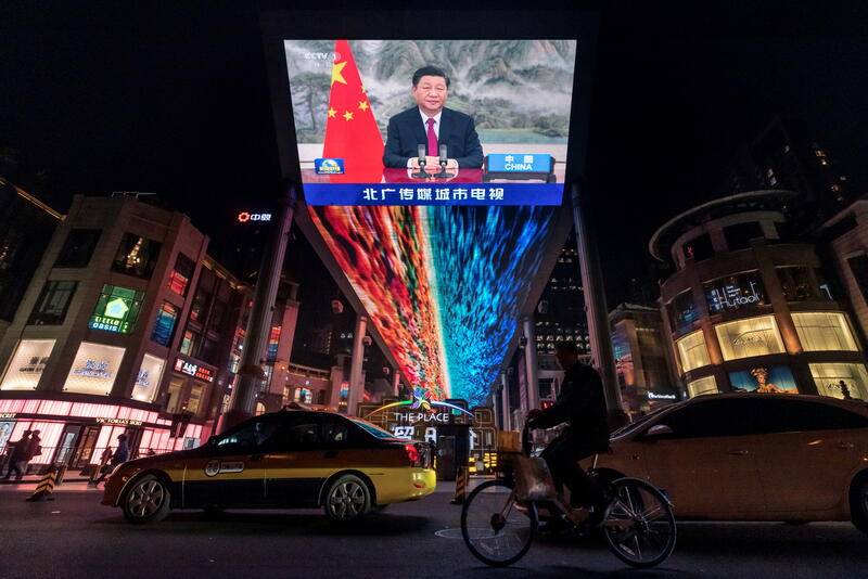 A screen displays a CCTV state media news broadcast showing Chinese President Xi Jinping addressing world leaders at the G20 meeting in Rome via video link at a shopping mall in Beijing, China, October 31, 2021. REUTERS/Thomas Peter