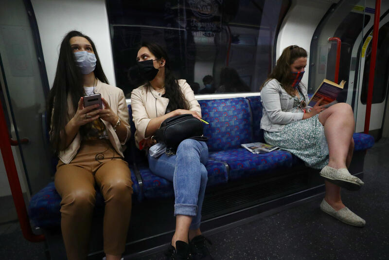 Passengers wearing face masks travel on the Central line tube, amid the spread of the coronavirus disease (COVID-19) in London, Britain June 15, 2020. REUTERS/Hannah McKay