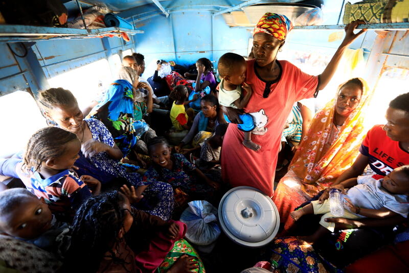 Ethiopian refugees who fled Tigray region, sit inside a courtesy bus at the Fashaga camp as they are transferred to Um-Rakoba camp on the Sudan-Ethiopia border, in Kassala state, Sudan December 13, 2020. REUTERS/Mohamed Nureldin Abdallah