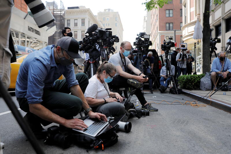 Members of the media are New York City, U.S. April 28, 2021. REUTERS/Andrew Kelly