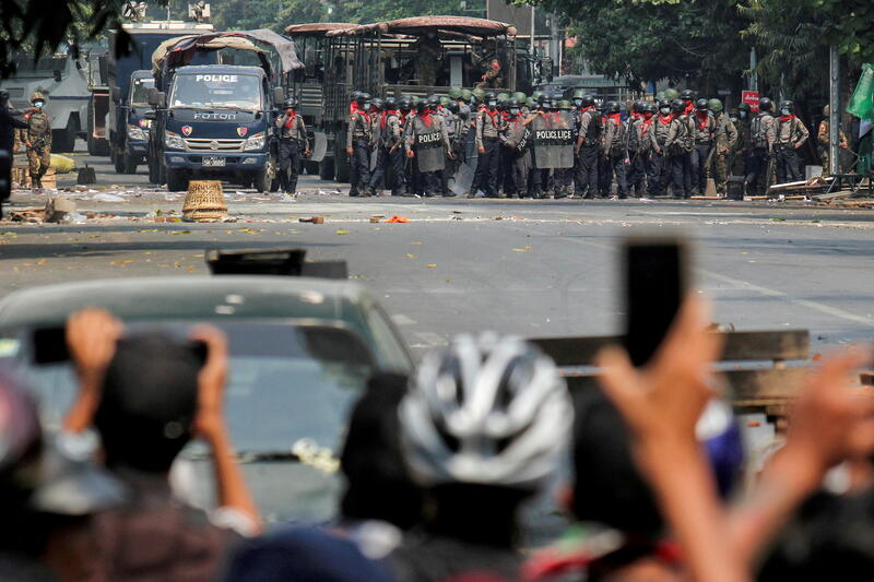Police stand on a road during an anti-coup protest in Mandalay, Myanmar, March 3, 2021. REUTERS