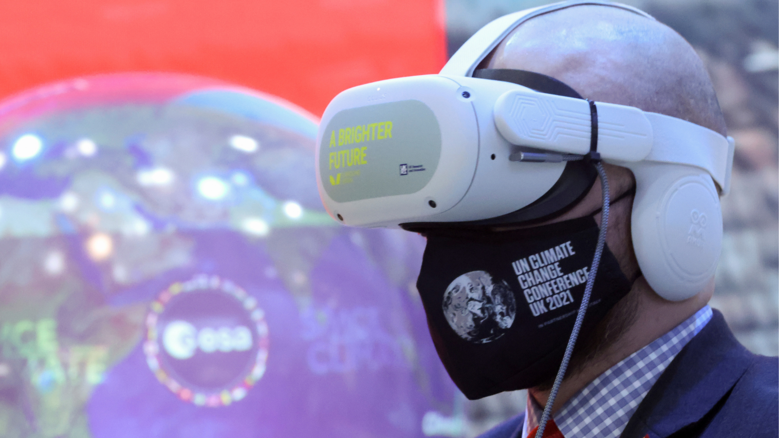 A delegate wears a VR headset at the media centre during the UN Climate Change Conference (COP26), in Glasgow, Scotland, Britain, November 4, 2021. REUTERS/Yves Herman