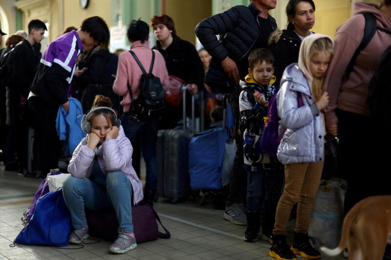 Ukrainian refugees rest in the ticket hall of Przemysl Glowny train station, after fleeing the Russian invasion of Ukraine, in Przemysl, Poland, March 26, 2022.REUTERS/Hannah McKay TPX IMAGES OF THE DAY