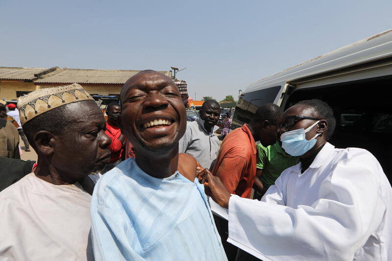 A man reacts as he receives a COVID-19 vaccine in Abuja, Nigeria. REUTERS/Afolabi Sotunde