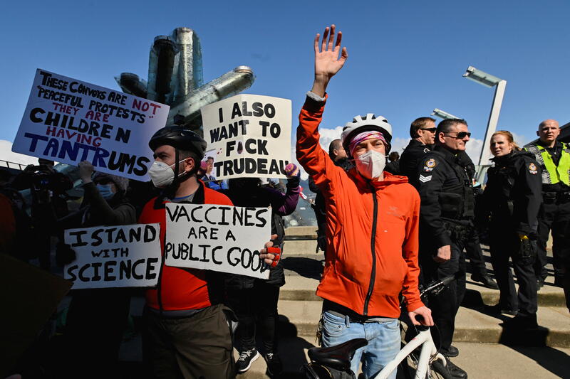 Counter-protesters disrupt a rally held by opponents of the coronavirus disease (COVID-19) vaccine and mask mandates, in downtown Vancouver, British Columbia, Canada March 19, 2022. REUTERS/Jennifer Gauthier
