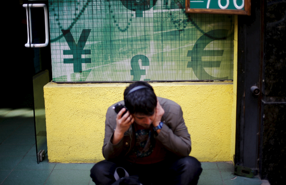 A man listens to audio over headphones on a street in Santiago, Chile. REUTERS/Ivan Alvarado