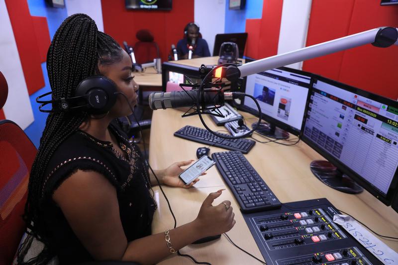 A radio presenter speaks about COVID-19 in Nigeria on 9 March 2020. REUTERS/Temilade Adelaja