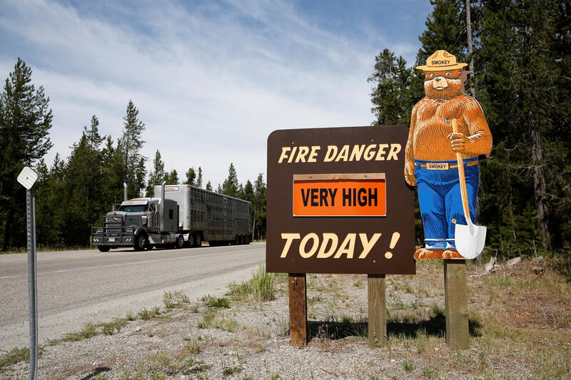A sign warns about high fire risk outside Yellowstone. 