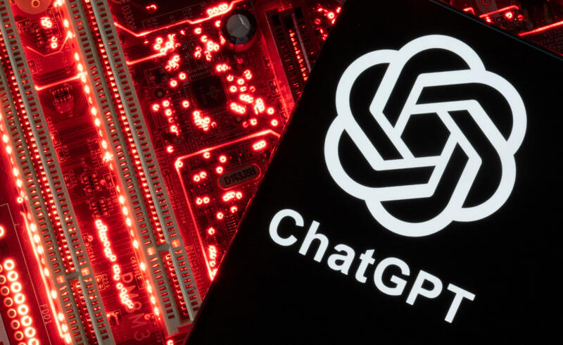 A smartphone with a displayed ChatGPT logo is placed on a computer motherboard in this illustration taken February 23, 2023. REUTERS/Dado Ruvic/Illustration