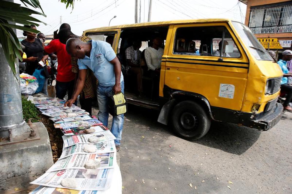 A man looks at newspapers at a vendor's stand in Lagos. REUTERS/Akintunde Akinleye