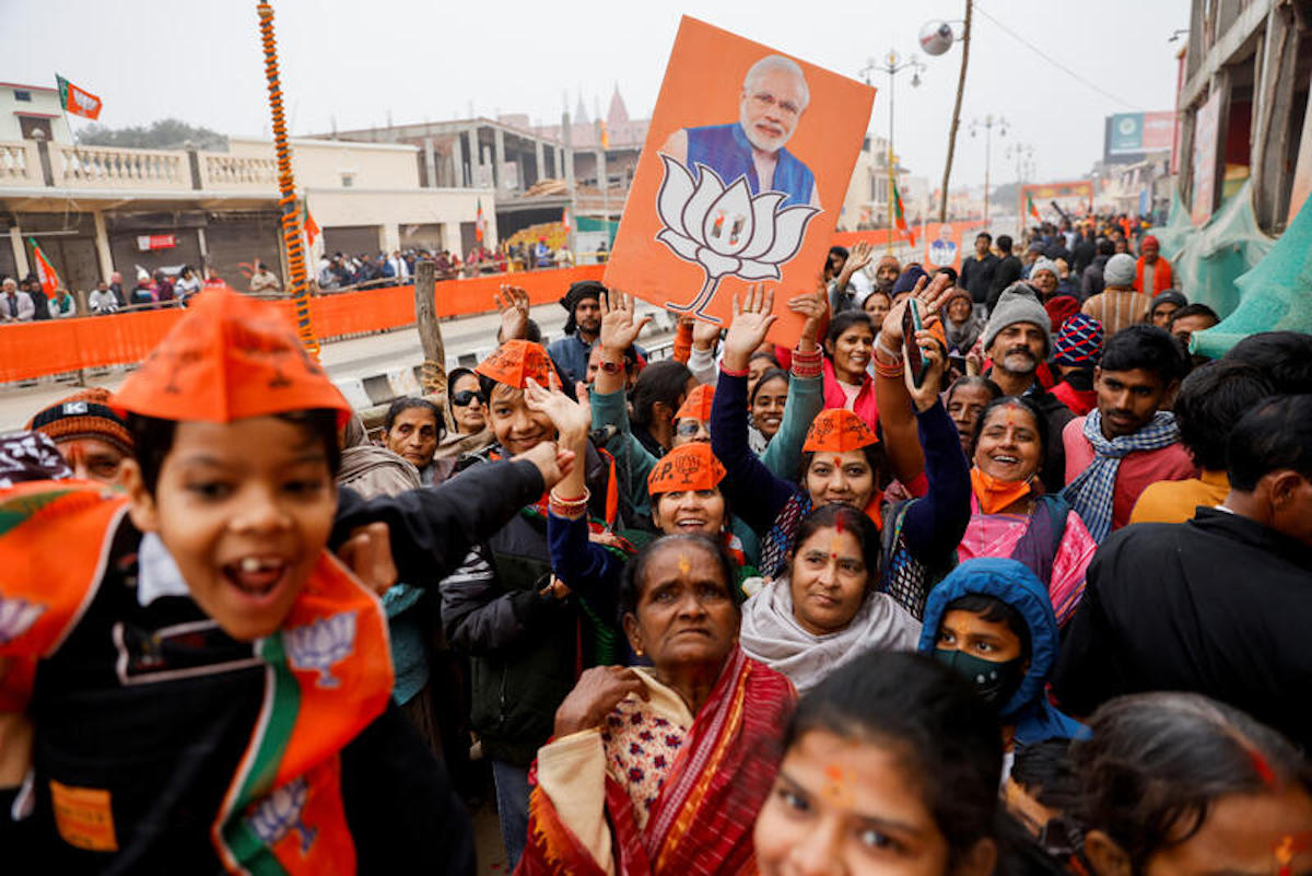 Supporters of BJP react after Prime Minister Narendra Modi's roadshow in Ayodhya, India, in December 2023. REUTERS/Anushree Fadnavis
