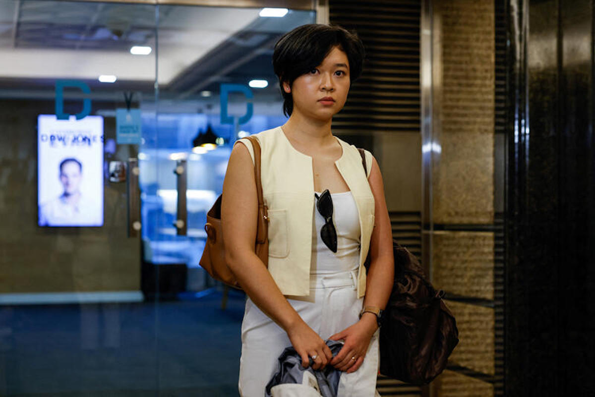 Selina Cheng, the newly elected chairperson of the Hong Kong Journalists Association, leaves office after her employment contract with the Wall Street Journal was terminated, in Hong Kong, China, July 17, 2024. REUTERS/Tyrone Siu