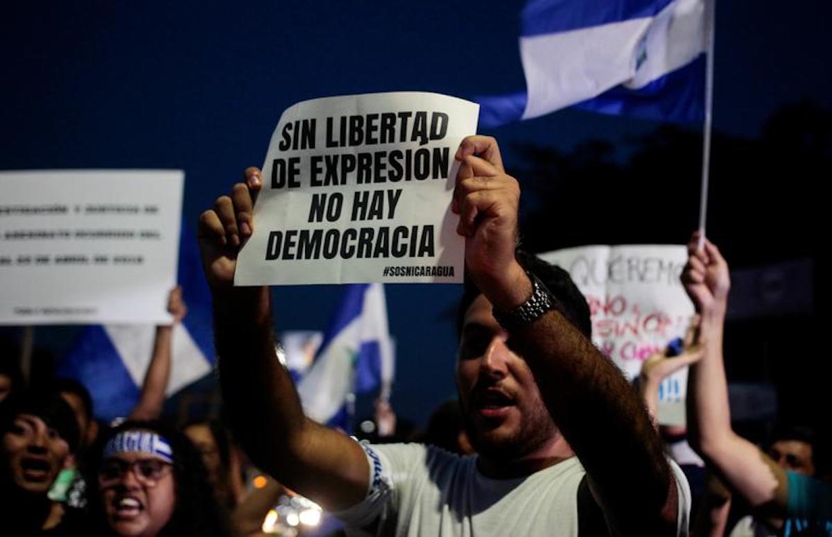 Demonstrators shout slogans against Nicaraguan President Daniel Ortega during a demonstration to mark World Press Freedom Day in Managua in May 2018. | REUTERS/Oswaldo Rivas