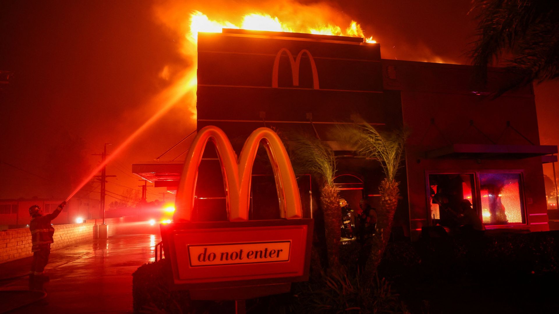 A branch of McDonald's on fire during the Los Angeles fires. Reuters / Mario Anzuoni