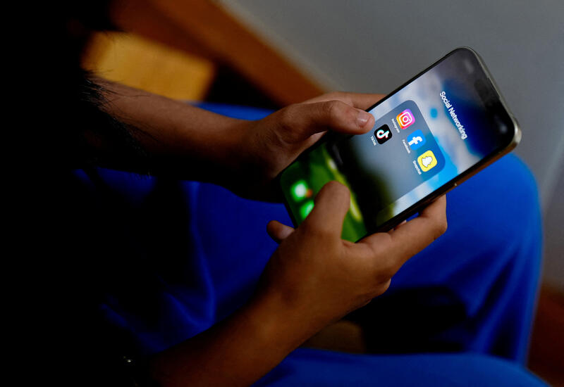 A person holding a smartphone. Reuters / Asanka Brendon Ratnayake