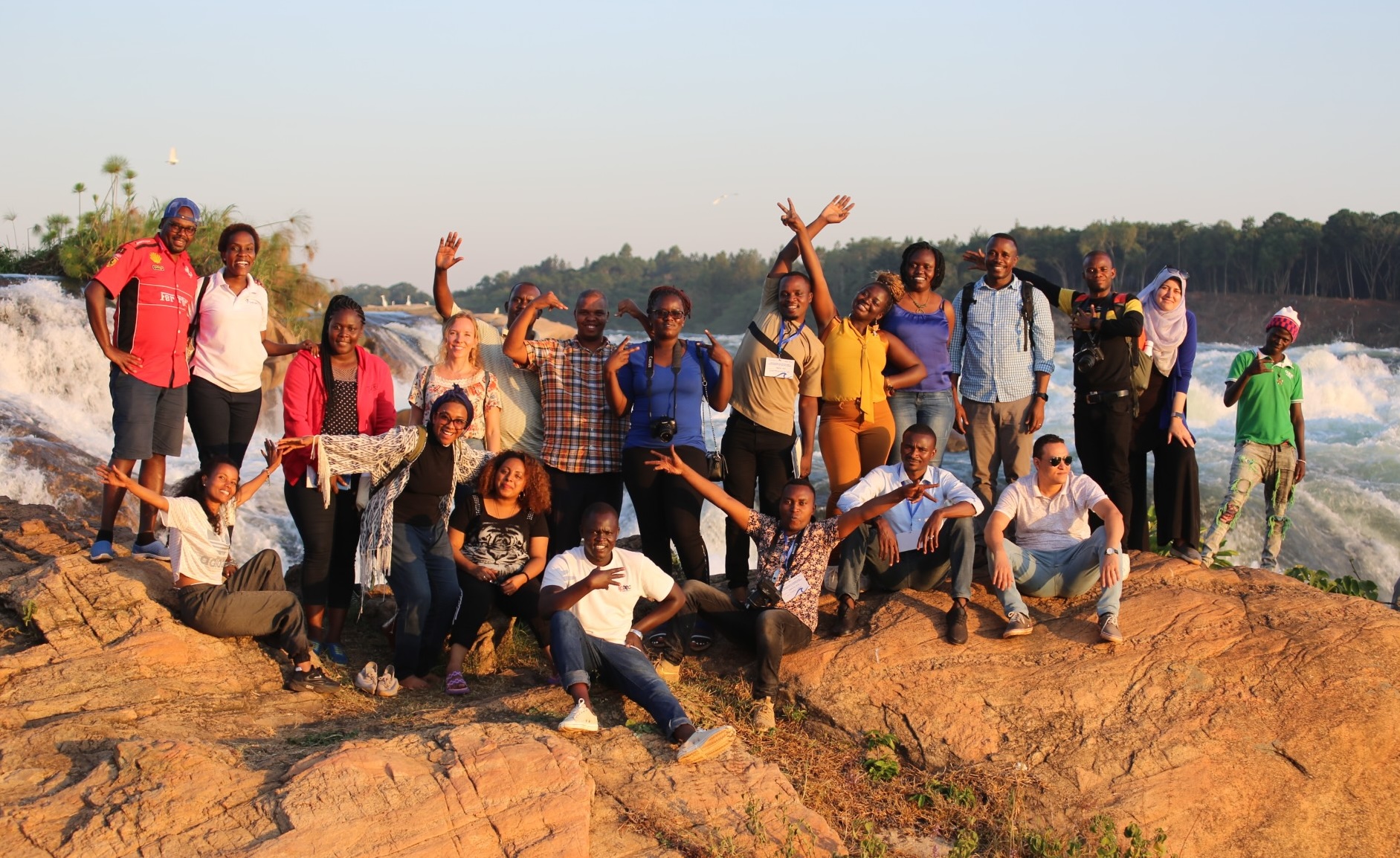 Journalists from Nile Basin pause for a photo on the River Nile in Jinja, Uganda, after a training on reporting about rivers organized by InfoNile.
