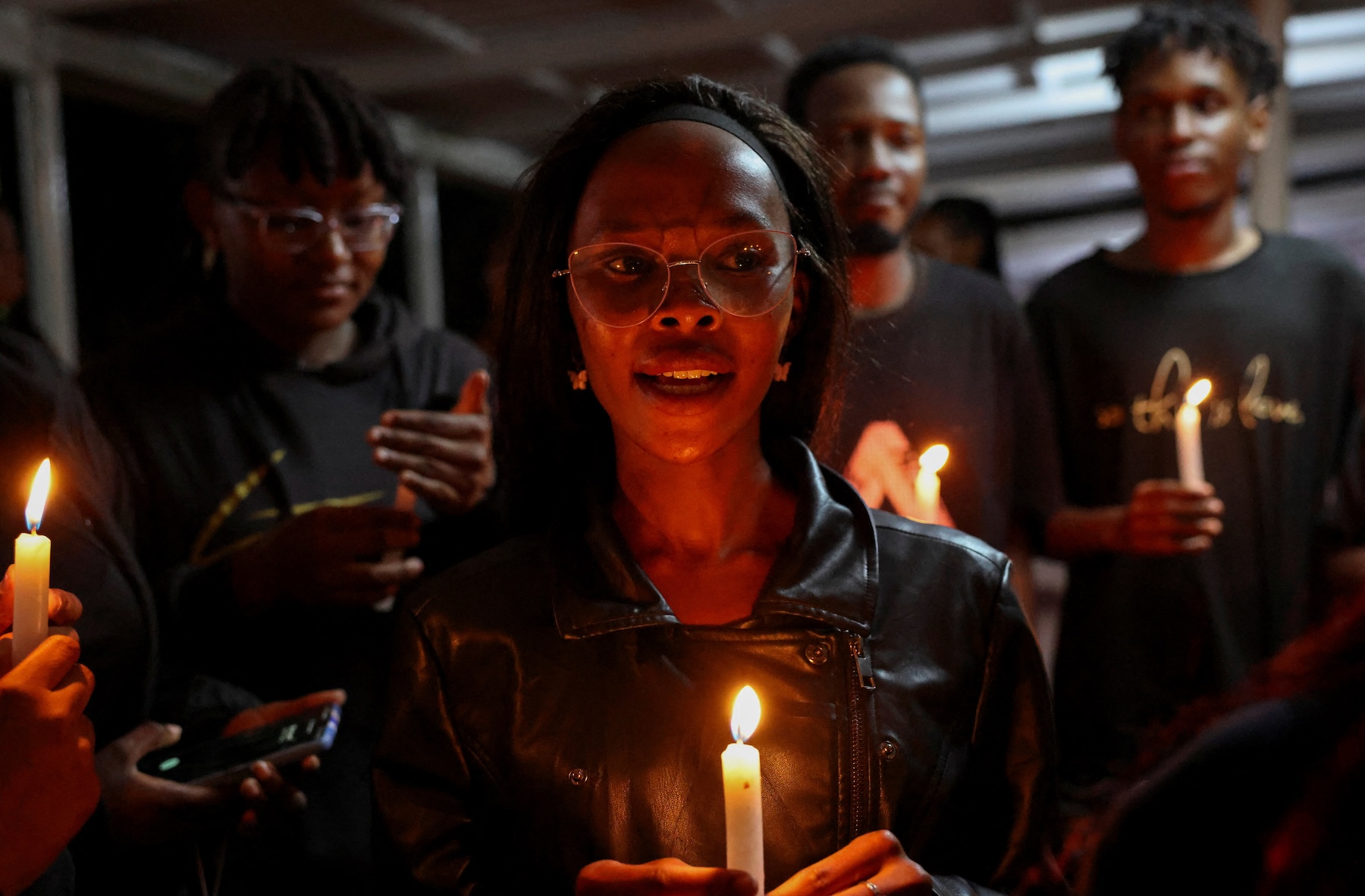 Activists and students participate in a vigil to raise awareness about gender-based violence (GBV) and honour the lives of women lost to femicide in higher learning institutions, at the Jomo Kenyatta University of Agriculture and Technology (JKUAT), in Juja, Kiambu County, Kenya, April 11, 2025. REUTERS/Monicah Mwangi