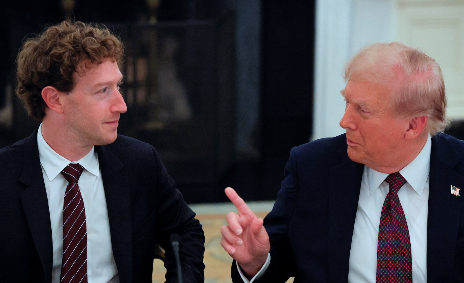 U.S. President Donald Trump speaks with Meta CEO Mark Zuckerberg during a private dinner for technology and business leaders in the State Dining Room at the White House in Washington, D.C., U.S., September 4, 2025. REUTERS/Brian Snyder