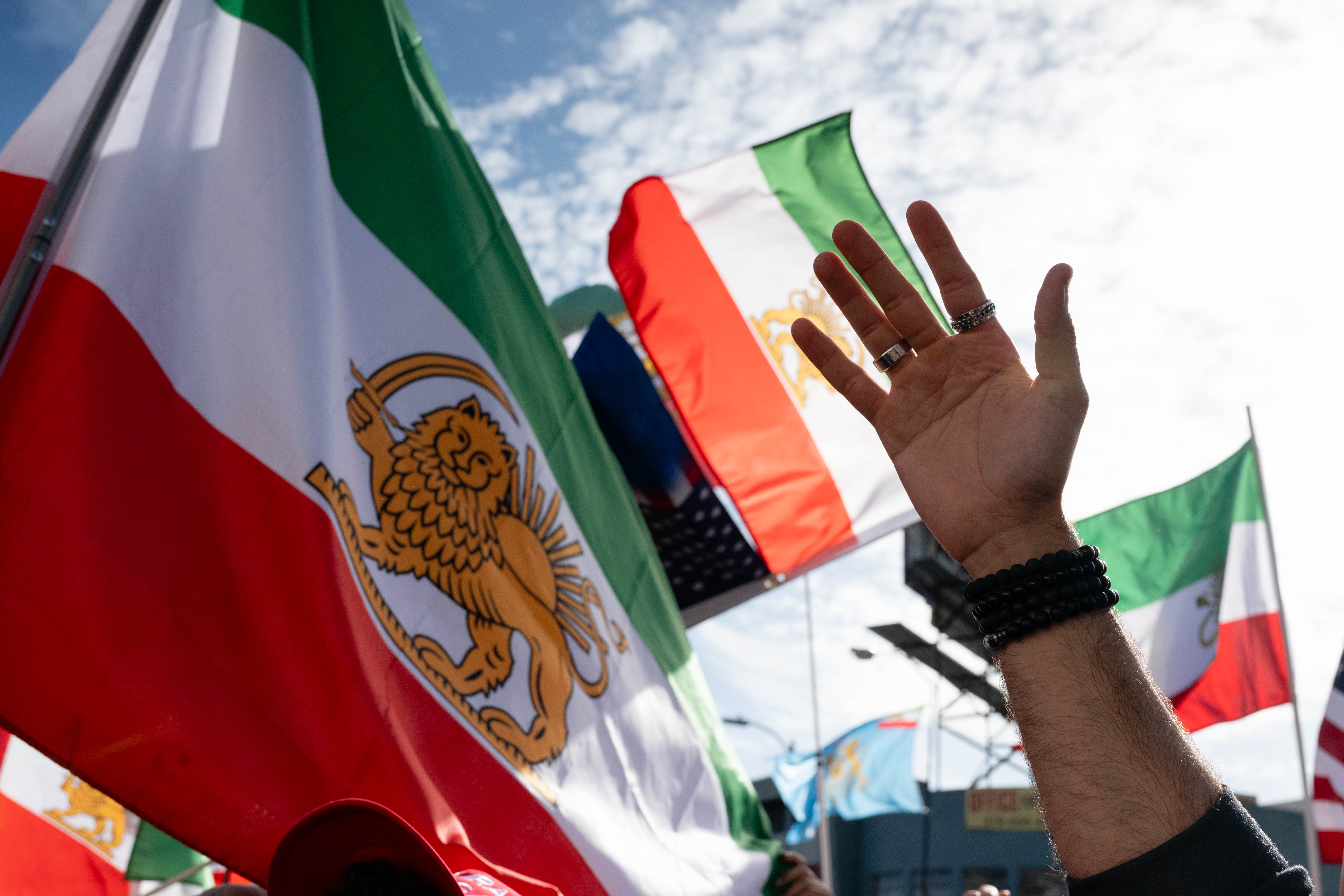 A protester raises a hand in support at Persian Square in the Westwood neighborhood of Los Angeles, California, during a rally for freedom in Iran. (Credit Image: © Ghawam Kouchaki/ZUMA Press Wire)
