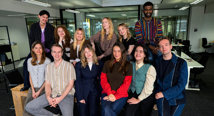 Journalists in a newsroom