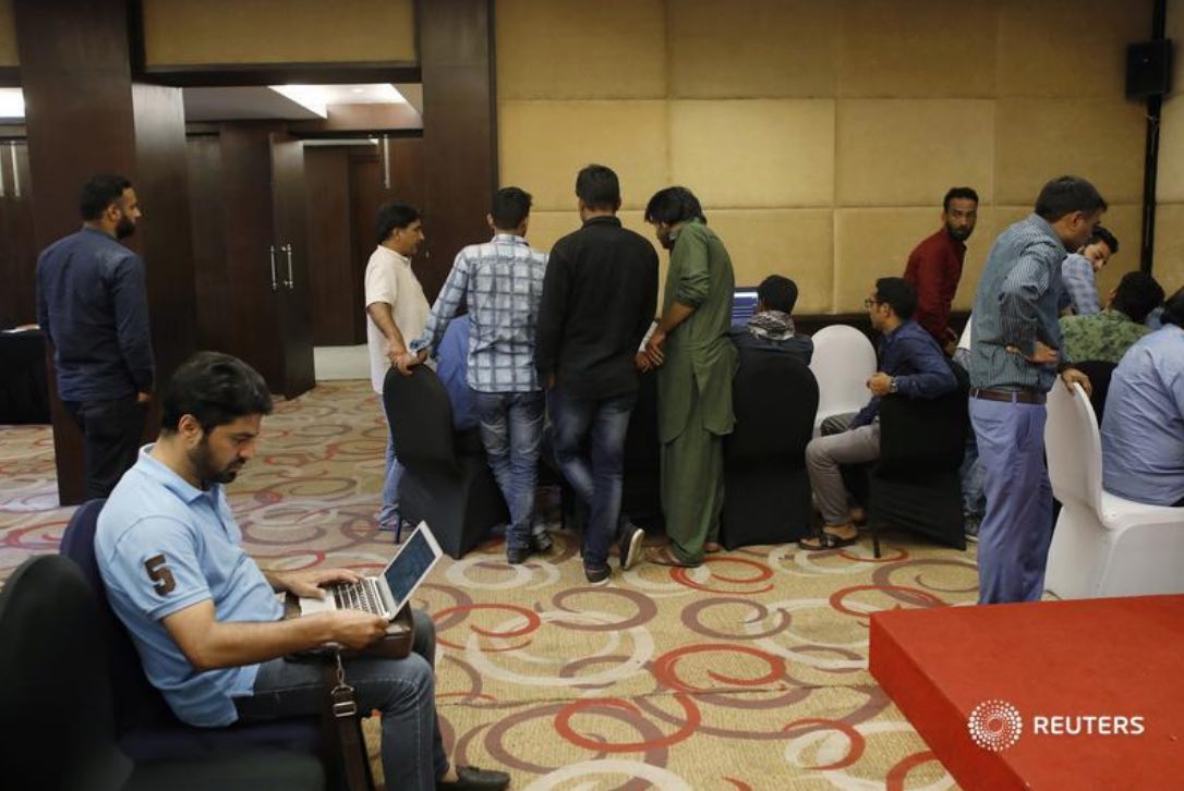 Journalists work at a government-run media center at Sarovar Portico hotel in Srinagar, August 20, 2019. REUTERS/Adnan Abidi