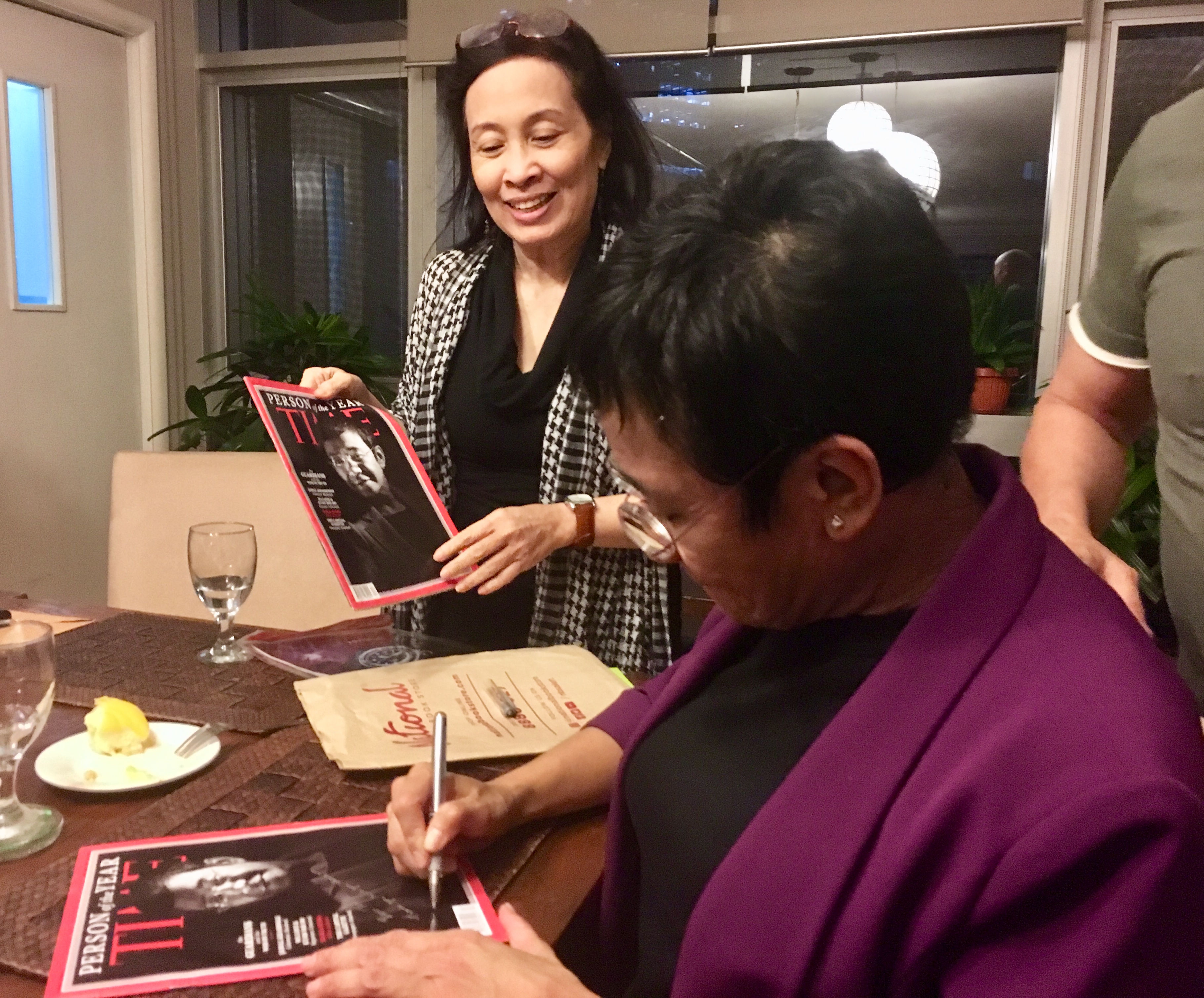 Maria Ressa signs Time Magazine edition