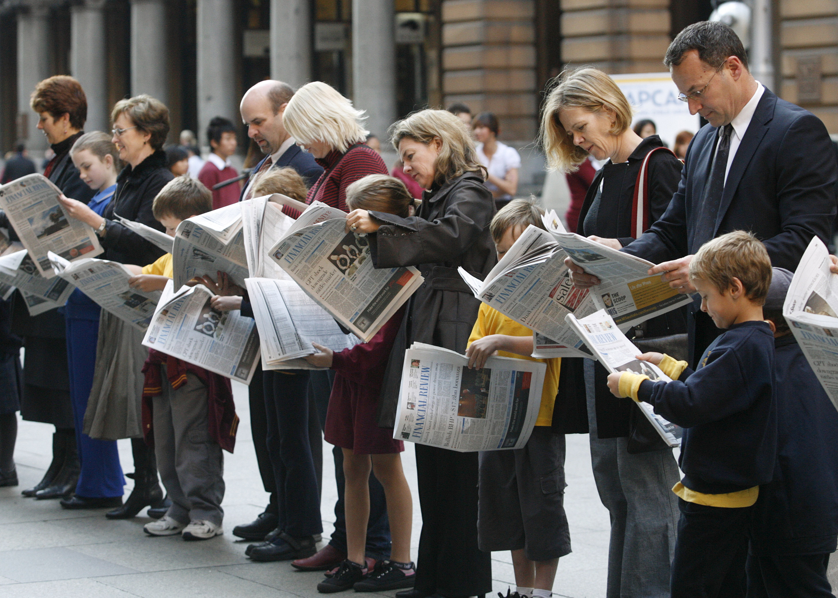 People reading newspapers