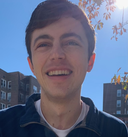 Portrait photo of Holden Foreman smiling outdoors