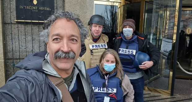 Pierre Zakrzewski takes a selfie with three colleagues in press bulletproof vests