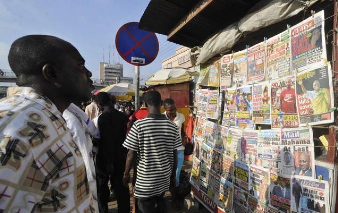 Man looks at news stand REUTERS/Yaw Bibini