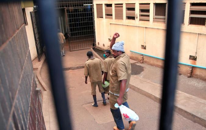 Zimbabwean journalist Hopewell Chin'ono arrives at court in Harare, Zimbabwe, August 7, 2020. REUTERS/Philimon Bulawayo