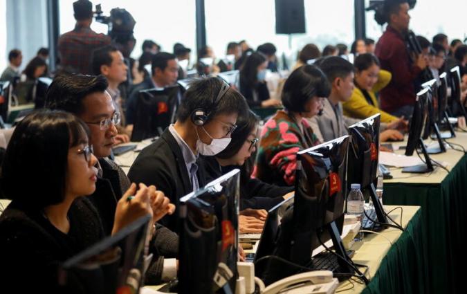 Journalists attend a press conference of 13th national congress of the ruling Communist Party of Vietnam, in Hanoi, Vietnam January 22, 2021. REUTERS/Kham