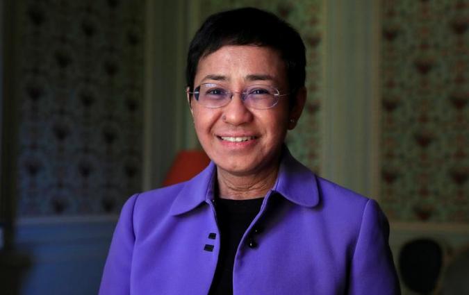 Maria Ressa, journalist and CEO of the Rappler news website, poses before a news conference to launch a commission to draft an "International Declaration on Information and Democracy" hold by Human rights group Reporters Without Borders in Paris, France, September 11, 2018. REUTERS/Gonzalo Fuentes