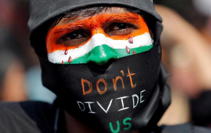 A demonstrator attends a protest against riots following clashes between people demonstrating for and against a new citizenship law in New Delhi, India, March 3, 2020. REUTERS/Adnan Abidi 