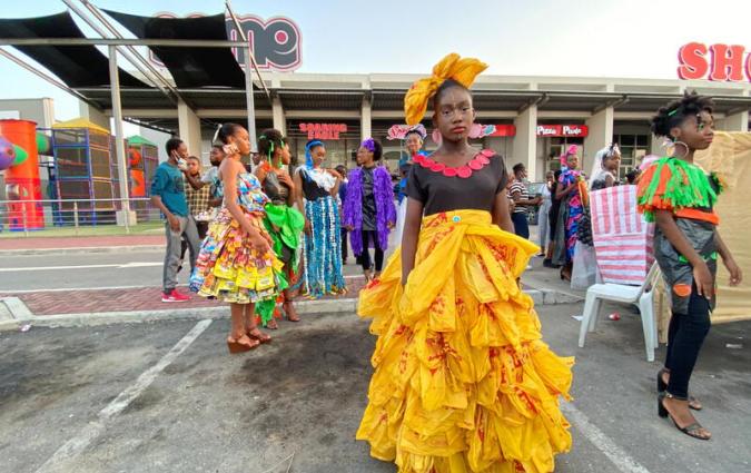 Young Nigerian climate change activists wear plastics recovered from waste, used to make garments during their annual show in Lagos. REUTERS / Seun Sanni
