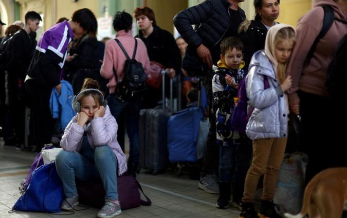 Ukrainian refugees rest in the ticket hall of Przemysl Glowny train station, after fleeing the Russian invasion of Ukraine, in Przemysl, Poland, March 26, 2022.REUTERS/Hannah McKay TPX IMAGES OF THE DAY
