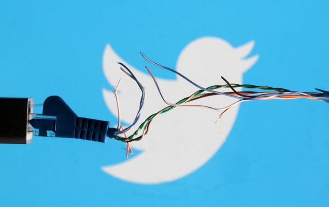 A split wire in front of the Twitter logo