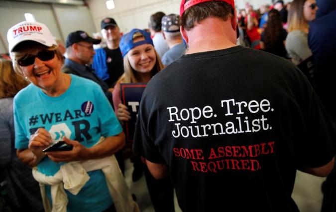 A man wears a shirt reading "Rope. Tree. Journalist." at a rally supporting Donald Trump in Minneapolis in 2016. REUTERS/Jonathan Ernst