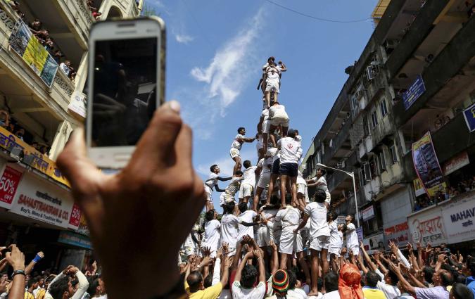 Devotees try to form a human pyramid to mark the Hindu festival of Janmashtami in Mumbai in 2015. REUTERS/Danish Siddiqui