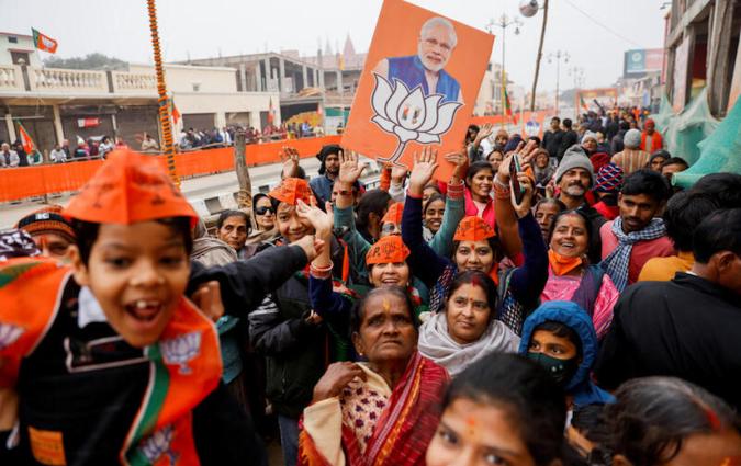 Supporters of BJP react after Prime Minister Narendra Modi's roadshow in Ayodhya, India, in December 2023. REUTERS/Anushree Fadnavis