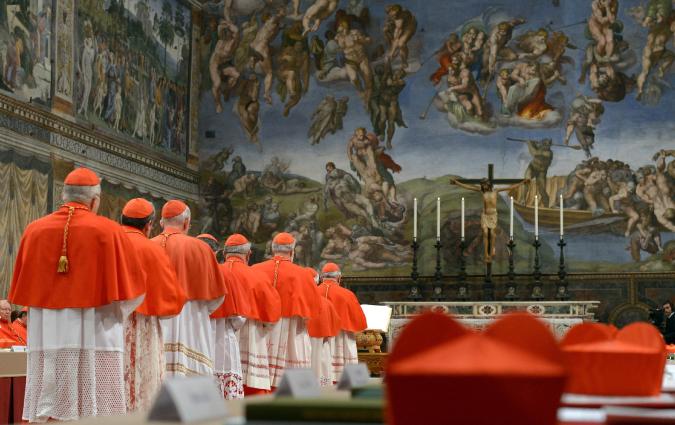 Cardinals entering the Sistine Chapel to begin the conclave in order to elect a successor to Pope Benedict on 12 March 12 2013. REUTERS/Osservatore Romano 