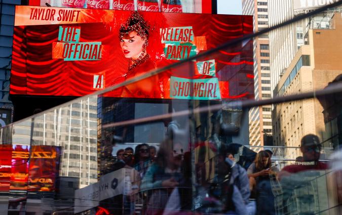 A billboard advertises "The Official Release Party of a Showgirl," a movie celebrating Taylor Swift’s new album "The Life of a Showgirl," in Times Square in New York City, U.S., October 3, 2025. REUTERS/Kylie Cooper