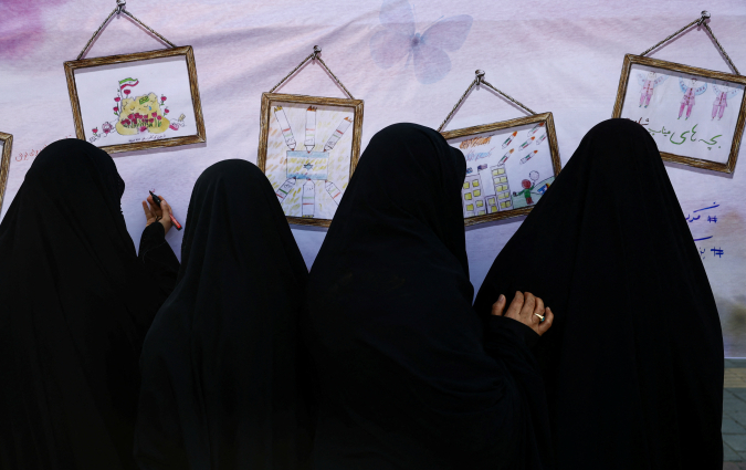 Iranian people attend a ceremony marking 40 days since schoolchildren were killed in a strike on a girls' primary school in Minab, amid the U.S.-Israeli conflict with Iran, in Tehran, Iran, April 7, 2026. Majid Asgaripour/WANA (West Asia News Agency)