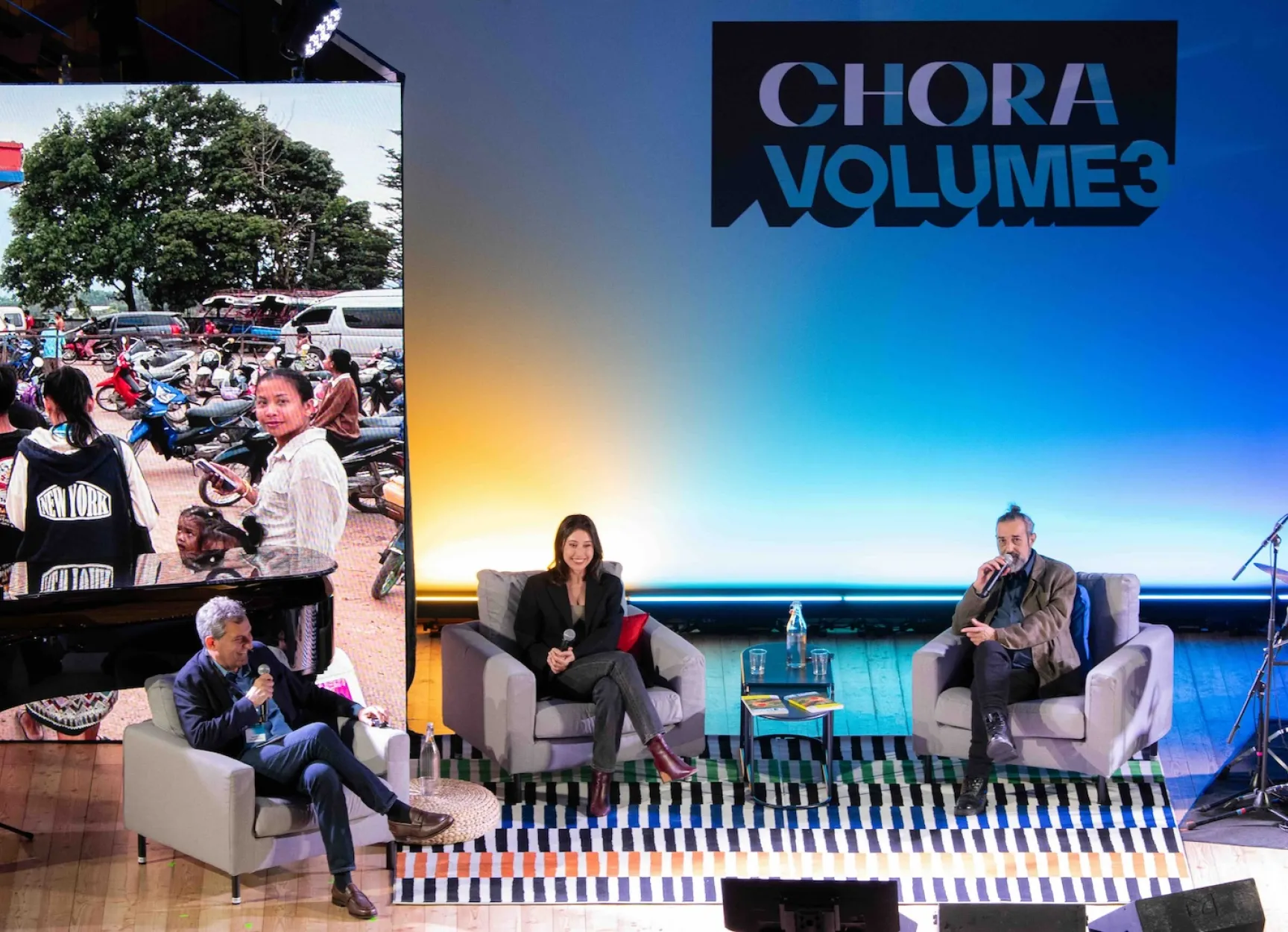 Mario Calabresi, Cecilia Sala and Simone Pieranni on stage at a Chora live event held in April 2026. Pieranni is a journalist at Chora specialising in foreign news from Asia. Image courtesy of Chora Media.