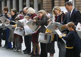 People reading newspapers