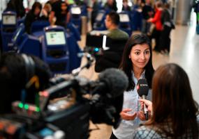 Press manager at SAS in Denmark Mariam Skovfoged talks with media as SAS pilots go on strike at Copenhagen Airport in Kastrup, Denmark