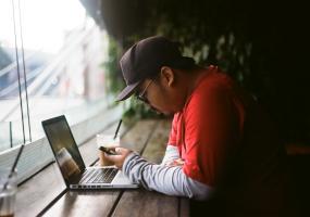 Man on phone and laptop