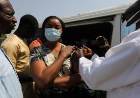 A woman receives the COVID-19 in West Africa. 