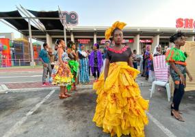 Young Nigerian climate change activists wear plastics recovered from waste, used to make garments during their annual show in Lagos. REUTERS / Seun Sanni